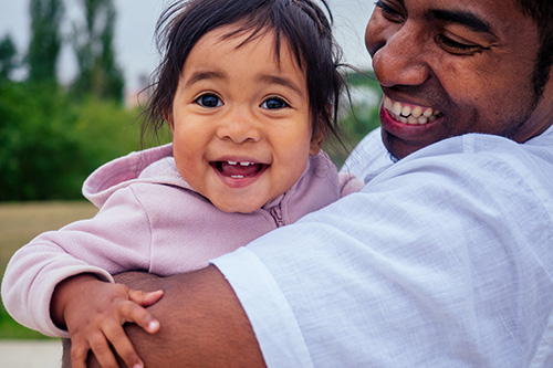 man holding small child