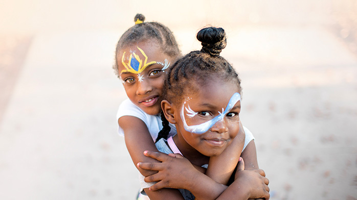 Two young girls with face paint